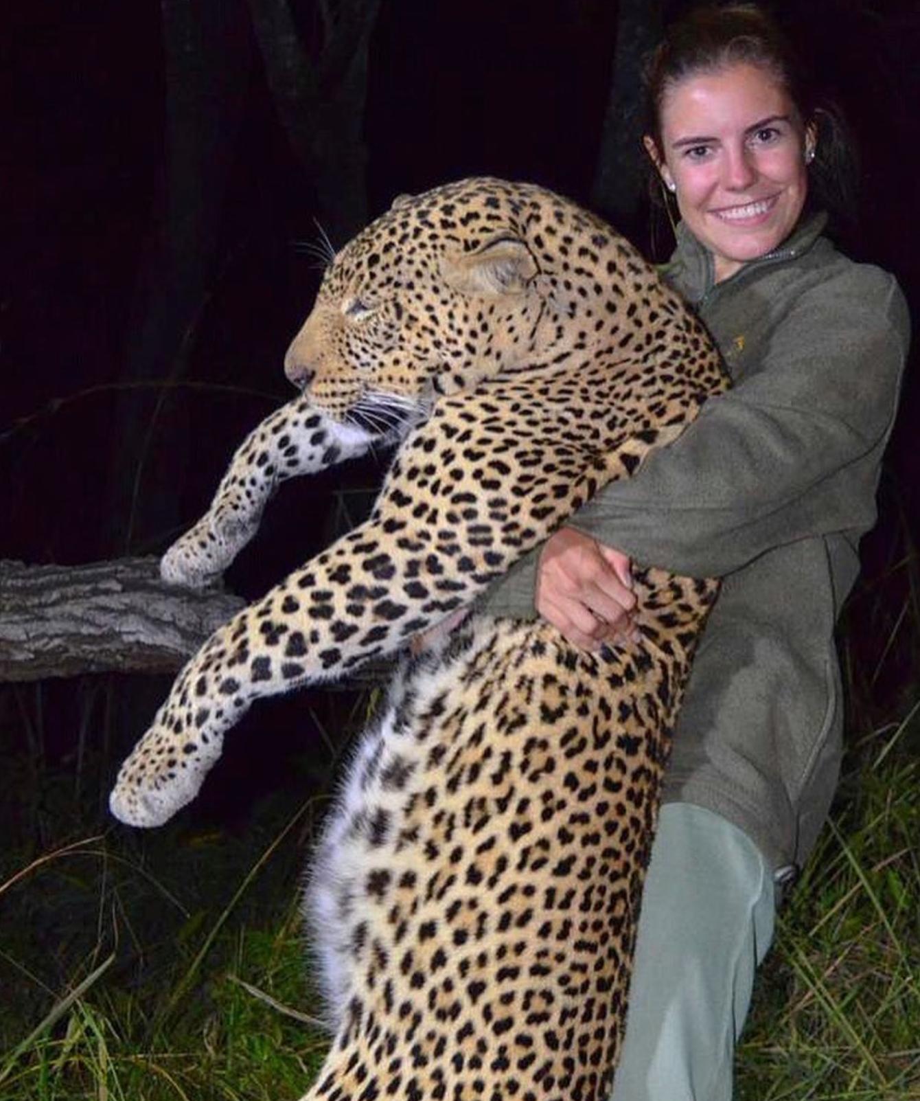 A woman hunter with a mature leopard taken on a Zimbabwe family hunting safari