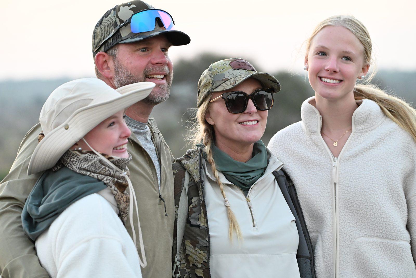 Family on a Kruger photo safari at sunset