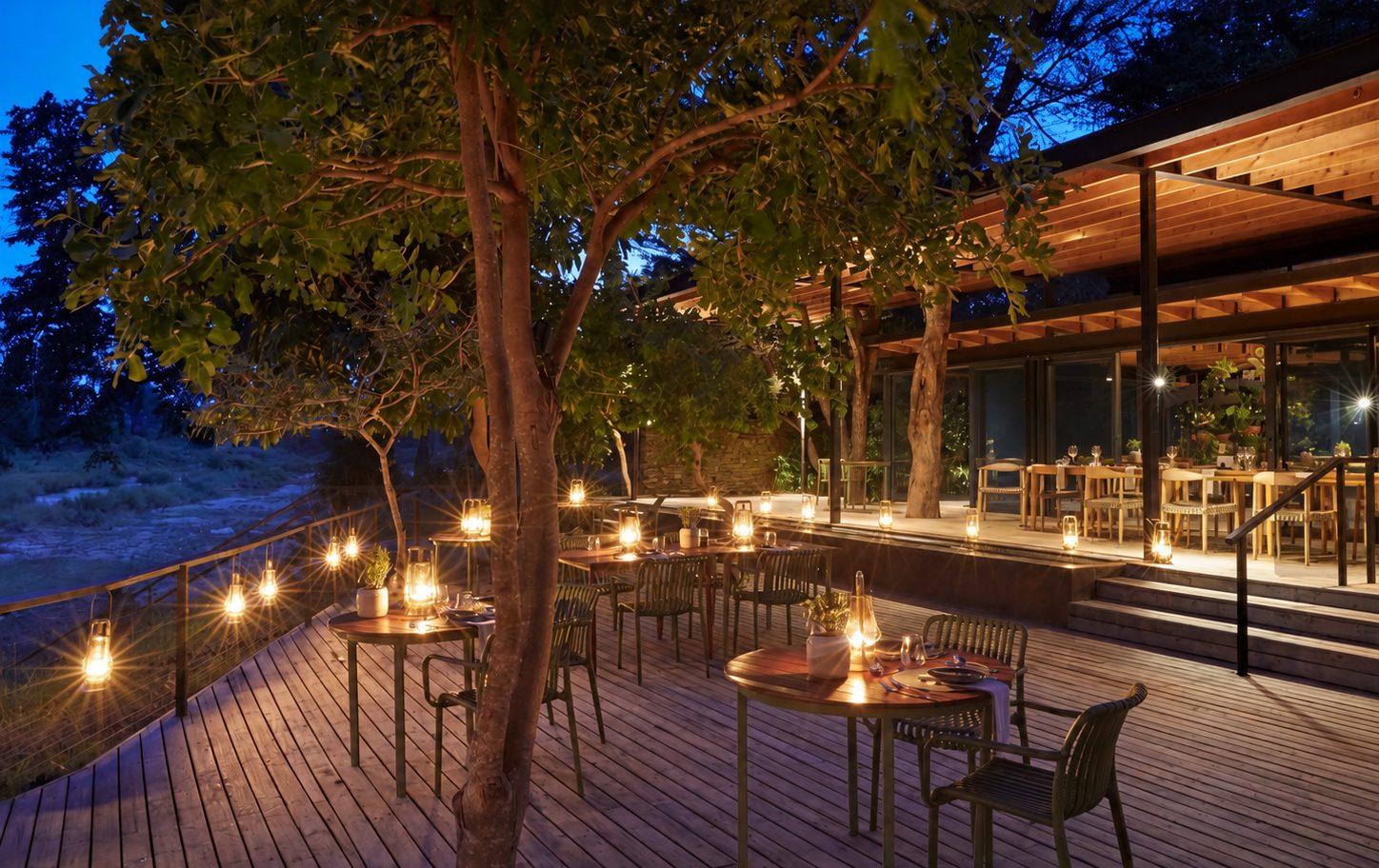 Lantern-lit deck at a Kruger safari lodge